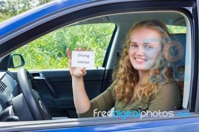 Young Dutch Woman Showing Card Driving License In Car Stock Photo