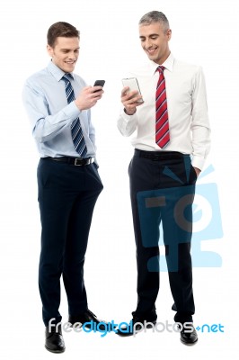 Young Executives Using Mobile Phone Stock Photo
