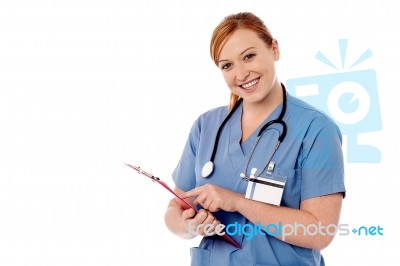 Young Female Specialist Holding Clipboard Stock Photo