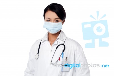 Young Female Surgeon Wearing Face Mask Stock Photo