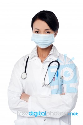 Young Female Surgeon Wearing Face Mask Stock Photo