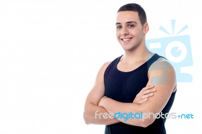 Young Fit Smiling Guy Posing Confidently Stock Photo
