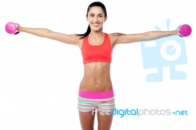 Young Fitness Woman Lifting Dumbbells Stock Photo