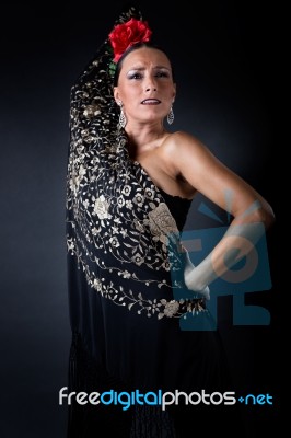 Young Flamenco Dancer In Beautiful Dress On Black Background Stock Photo