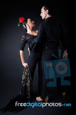 Young Flamenco Dancers In Beautiful Dress On Black Background Stock Photo