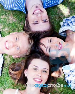 Young Friends Forming A Circle Stock Photo