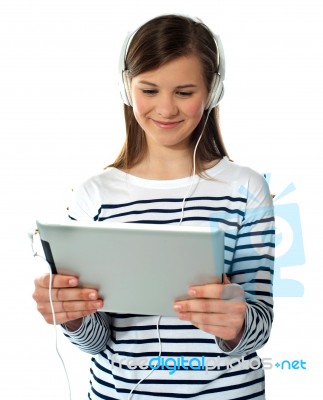 Young Girl Enjoys Listening Music Stock Photo