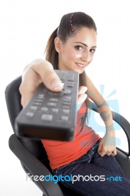 Young Girl Holding Remote Stock Photo