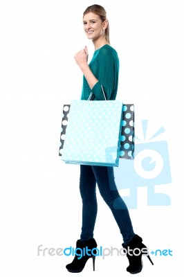 Young Girl Holding Shopping Bags Stock Photo