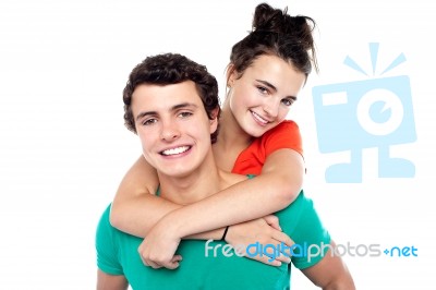 Young Girl Hugging Her Husband Stock Photo