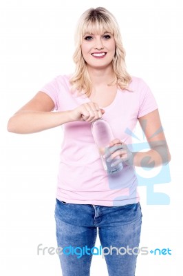 Young Girl Opening Bottle Of Clean Water Stock Photo