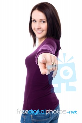 Young Girl Pointing Towards The Camera Stock Photo