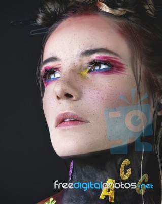 Young Girl With Creative Alphabet Makeup Stock Photo