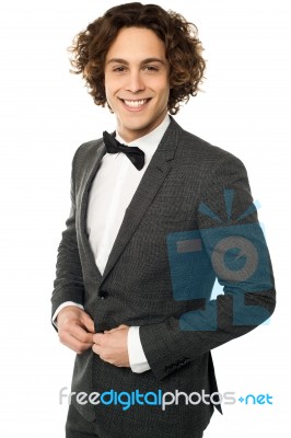 Young Groom Buttoning Up His Blazer Stock Photo