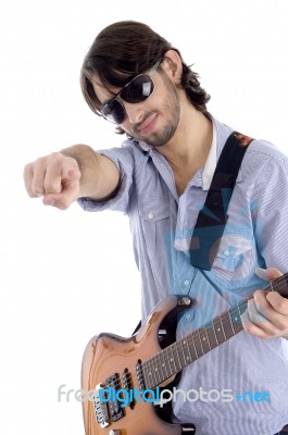 Young Guitarist With Pointing Finger Stock Photo