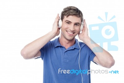 Young Guy Listening To Music Stock Photo