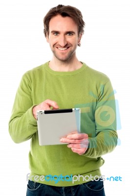 Young Guy Operating Tablet Device Stock Photo