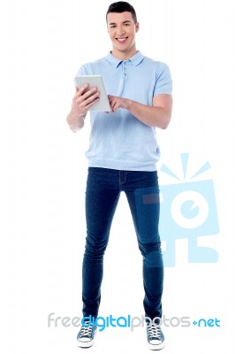 Young Guy Using His Tablet Pc Stock Photo