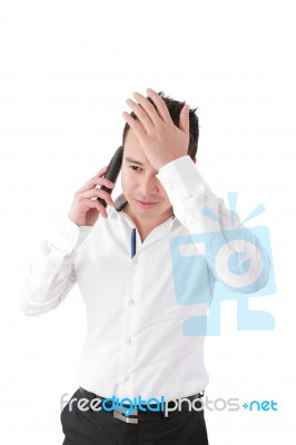 Young Handsome Businessman Talking At The Cell Phone Stock Photo