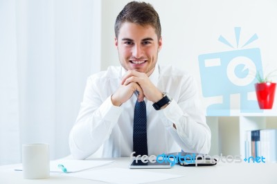 Young Handsome Man Working In His Office Stock Photo