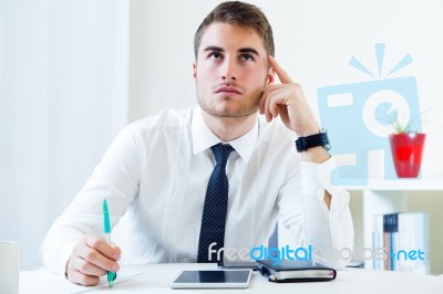 Young Handsome Man Working In His Office Stock Photo