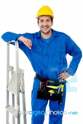 Young Handyman With Step-ladder Stock Photo