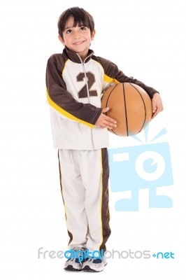 Young Kid In His Sports Dress With Basketball Stock Photo Young Kid In His Sports Dress With Basketball Stock Photo
