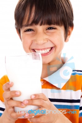 Young Kid With Glass Of Milk Stock Photo