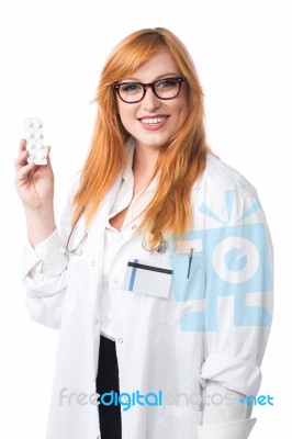 Young Lady Doctor Showing Medicine Stock Photo