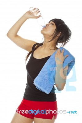 Young lady drinking water Stock Photo
