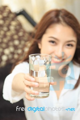 Young Lady Give A Glass Of Water Stock Photo
