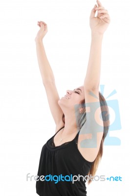 Young Lady With Arms Raising Stock Photo