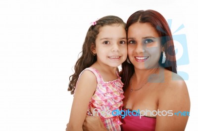 Young Latin Mother Hugging Her Daughter Isolated On A White Back… Stock Photo