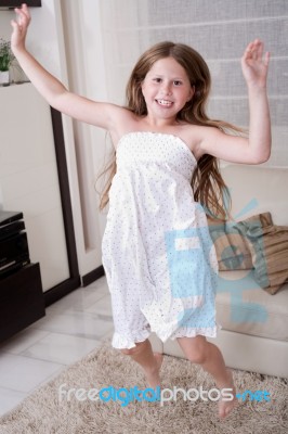 Young Little Girl Jumping Stock Photo