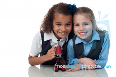 Young Little School Girls With Microscope Stock Photo