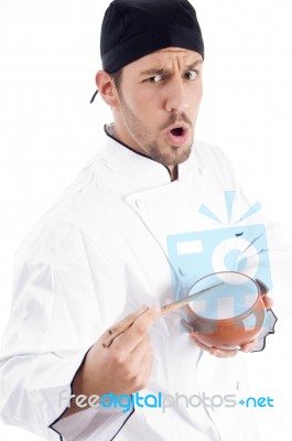 Young Male Chef Holding Bowl Stock Photo