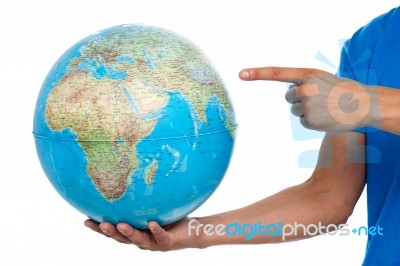 Young Male Holding Globe Stock Photo