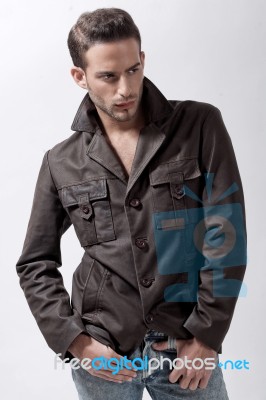Young Male Model With Brown Jacket Stock Photo