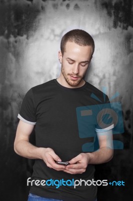 Young male reading sms Stock Photo