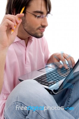 Young male using laptop Stock Photo