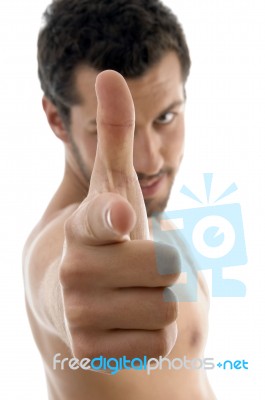 Young Male With Shooting Gesture Stock Photo