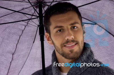 Young Male With Umbrella Stock Photo