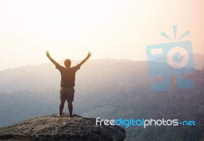 Young Man  Asia Tourist  At Mountain Is Watching Over The Misty Stock Photo