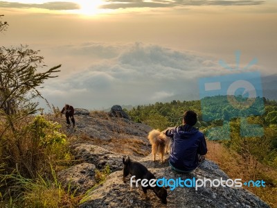 Young Man  Asia Tourist  At Mountain Is Watching Over The Misty Stock Photo