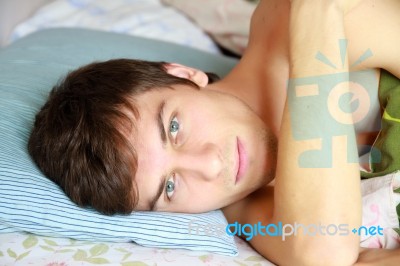 Young Man Awake Stock Photo