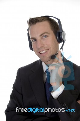 Young Man Calling With Headset And Smiling Stock Photo