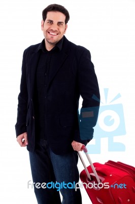 Young Man Carrying Travel Bag Stock Photo