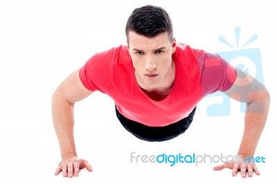 Young Man Doing Push-ups Stock Photo