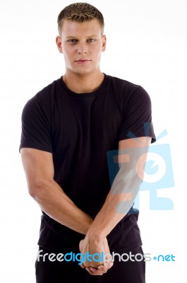 Young Man flexing arm muscles Stock Photo