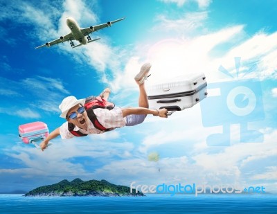 Young Man Flying From Passenger Plane To Natural Destination Isl… Stock Photo